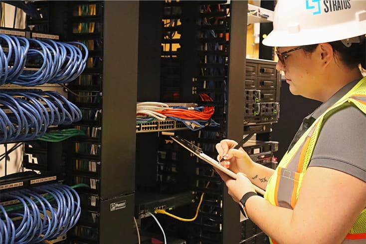 commissioning services professional engineer writing on clipboard