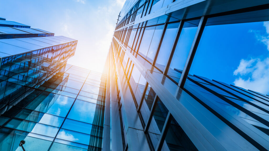 Modern office building against blue sky