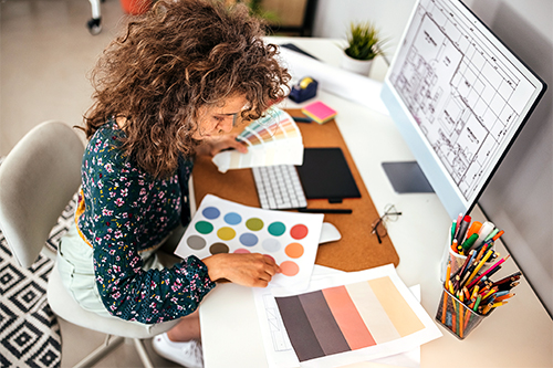 Female designer holding color swatches